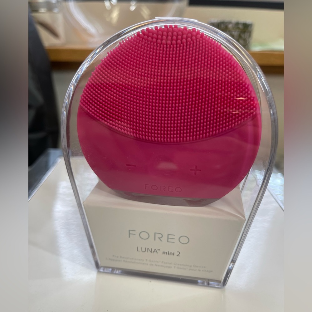 NWT Luna mini face cleaning device available in hot pink or turquoise
